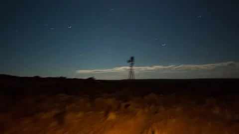 A dark nighttime drive time lapse on a gravel road with two dirt tracks in a Stock-Footage 143642935
