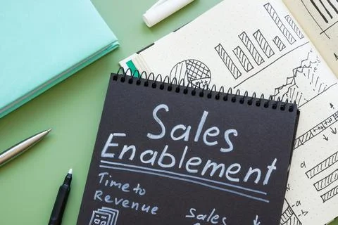 Dark notebook with notes on sales enablement. Stock Photos