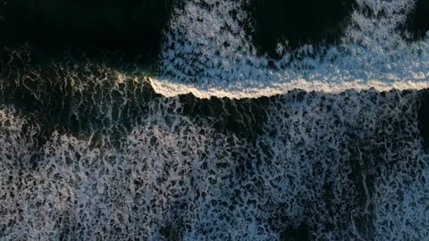 Dark Ocean Waves Rolling at Sunrise – Aerial Hover Over the Pacific Stock Footage 300510109