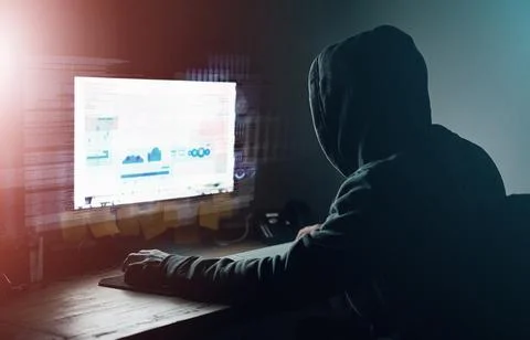 Dark, office and man at computer for hacking, online programming and Foto stock