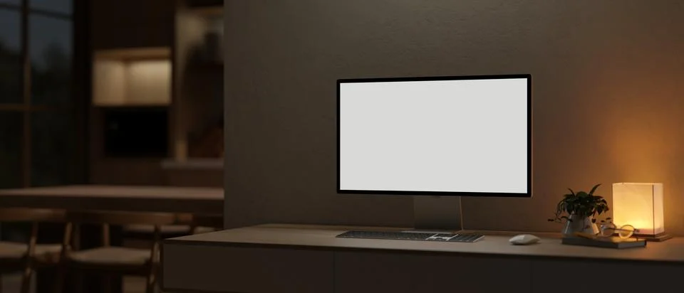 Dark office workspace, a PC computer mockup and a table lamp on a table in .. 스톡 일러스트