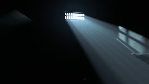 Dark old cell interior with barred up window. Sun rays coming through the fog. Stock Footage 85934661