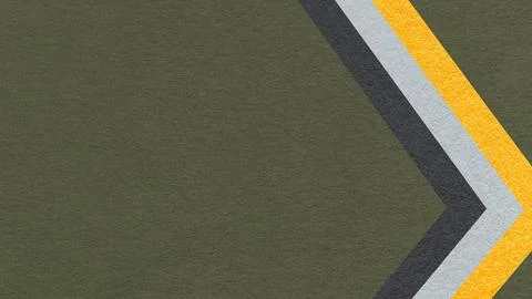 Dark olive green paper texture background with yellow black chevron stripes.. Stock Photos
