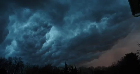 Dark ominous clouds rolling in the sky ready to storm and rain Stock Footage 205447846
