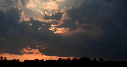 Dark ominous, cloudy time lapse sunset mostly obscured by clouds Stock Footage 152528300