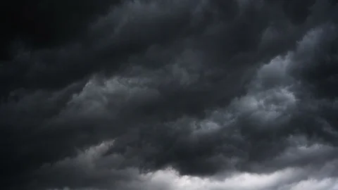 Dark ominous grey storm clouds. Dramatic sky. lighting in dark stormy clouds Stock Footage