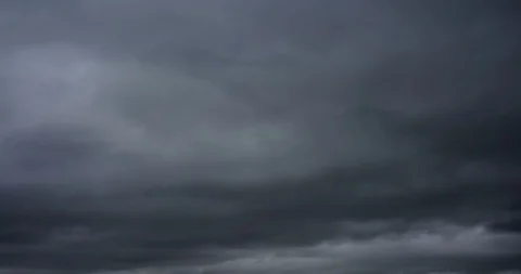 Dark ominous grey storm clouds. Dramatic sky. Storm rain clouds. Stock Footage 120299341