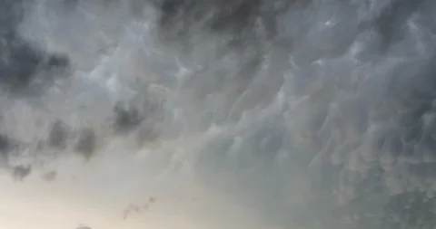 Dark ominous grey storm clouds. Dramatic sky. Storm rain clouds. 動画素材 120648003