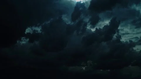 Dark ominous storm clouds with a break of light in the center timelapse, time l Stock Footage 341168381