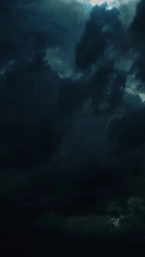 Dark ominous storm clouds with a break of light in the center timelapse, time Stock Footage 341367682