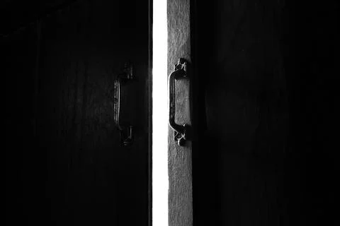 Dark open door light Stock Photos