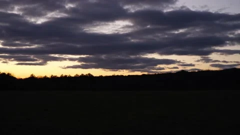 Dark Open Green Field with Orange Sunset, Golden Hour, Purple Clouds, P2 Stock Footage