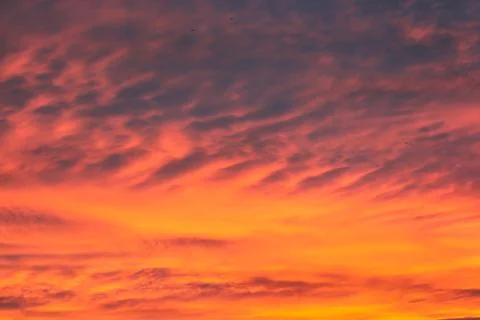 Dark orange clouds at sunset. Stock Photos