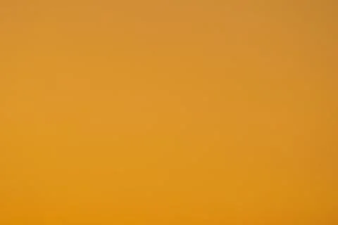 Dark orange gradient background, shot of the sky at sunset. Abstract blank .. Stock Photos