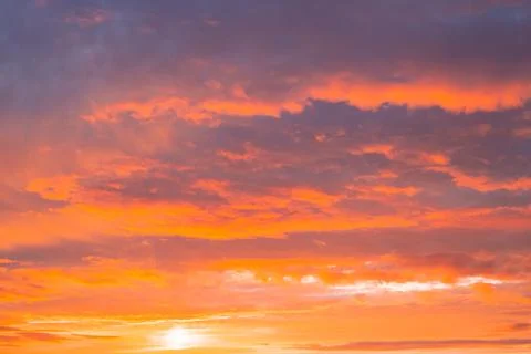 Dark orange sky with clouds at sunset. Natural natural bright background Stock Photos
