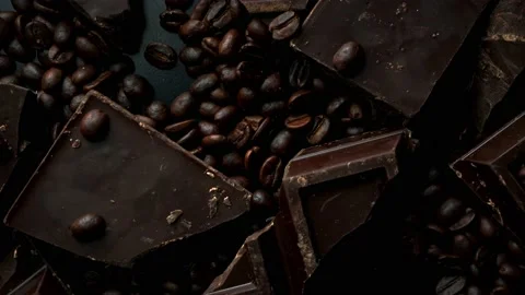Dark organic chocolate and coffee beans on concrete background Stock Footage 141895553