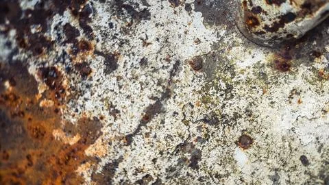 Dark oxidized metal with deep rust patterns and surface damage. Full area b.. Stock Photos
