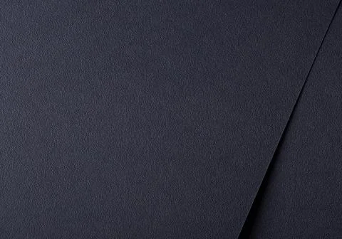 Dark paper background with a smooth, abstract texture and elegant pattern. Stock Photos