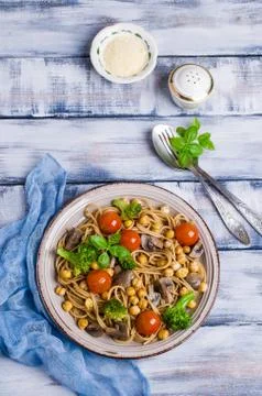 Dark pasta with vegetables Stock Photos