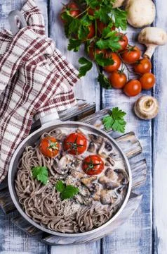 Dark pasta with vegetables Stock Photos