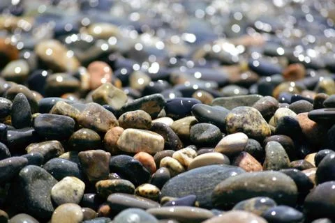 Dark pebble closeup.  Stock Photos