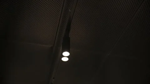 Dark perforated ceiling with two recessed spotlights Video stock 311278241