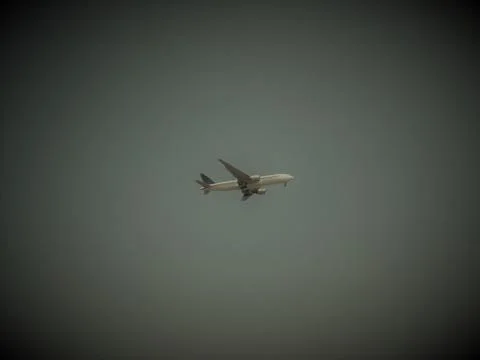 Dark the plane in  the sky Stock Photos