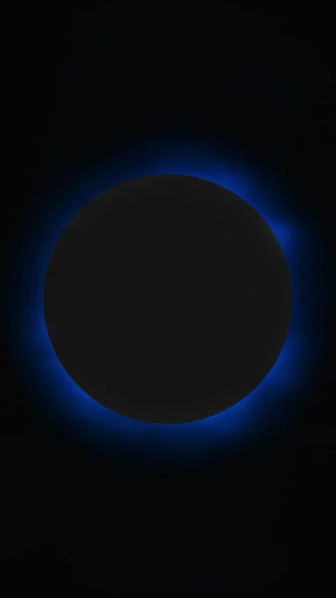Dark planet eclipse blue glow background black circular silhouette, luminous rim Stock Footage 340565124