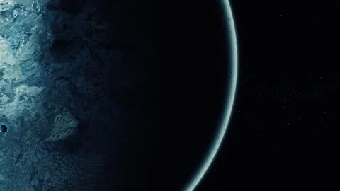 Dark planet or moon with a glowing edge against a starry space background Stock Footage 337079270