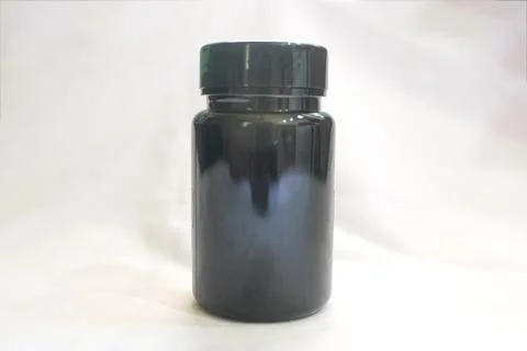 Dark Plastic Supplement Bottle on a White Background Stock Photos