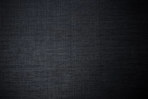 Dark plastic texture like a fabric with gradient light and shadows. Stock Photos