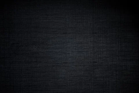 Dark plastic texture like a fabric with gradient light and shadows. Stock Photos