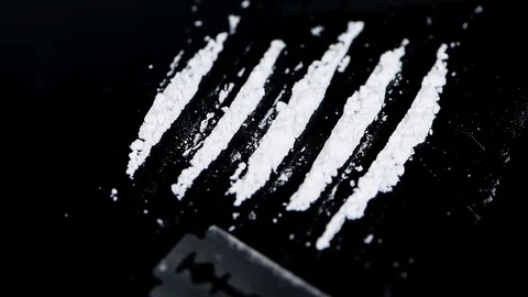 Dark plate with Cocaine (seamless loopable) Stock Footage