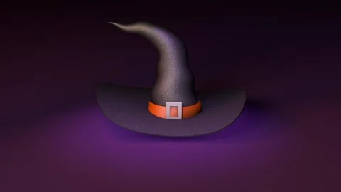 Dark pointed witch hat with an orange band and square buckle gently moves above Stock Footage 345504886