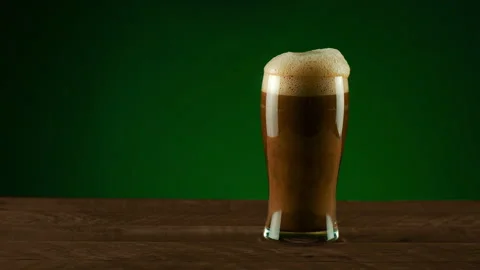 Dark Porter Beer Spilling Over Stock Footage 141534426