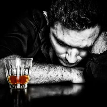 Dark portrait of a drunk man Stock Photos