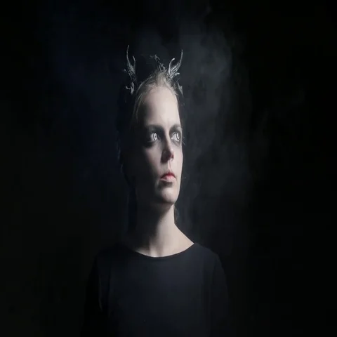 Dark portrait of evil witch in smoke. 4K UHD Stock Footage 69412298