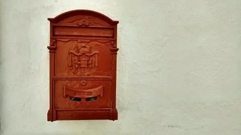 Dark post box on wall. Old Malta post box. Stock Photos