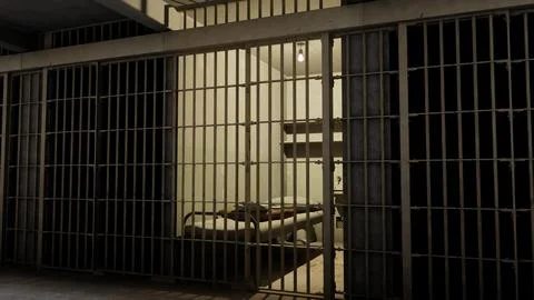 Dark prison cell behind bars illuminated by single light bulb 3D render Stock Illustration
