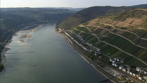 Dark puffy clouds moving over the bright orange sun at sunset Stock Footage 109437845