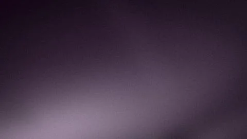 Dark purple gradient background with soft blur grainy texture perfect for t.. Stock Photos