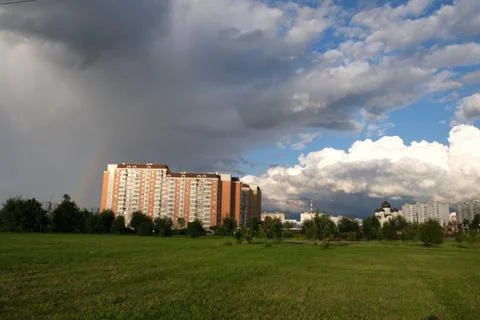 Dark rain clouds against the background of the Moscow sleeping area. Stock Photos