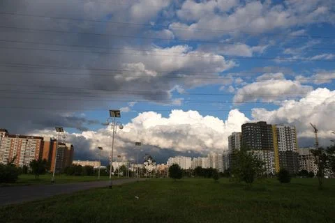 Dark rain clouds against the background of the Moscow sleeping area. Stock Photos