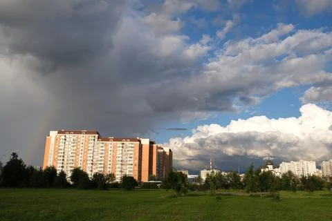 Dark rain clouds against the background of the Moscow sleeping area. Stock Photos