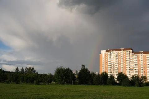 Dark rain clouds against the background of the Moscow sleeping area. Stock Photos
