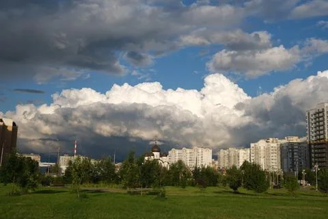 Dark rain clouds against the background of the Moscow sleeping area. Stock Photos
