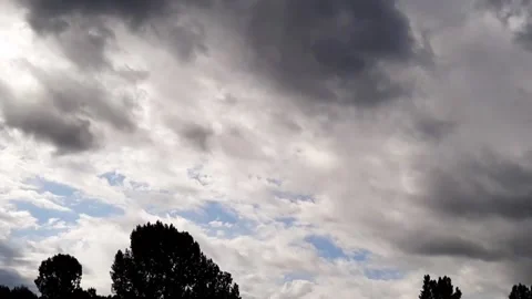 Dark rain clouds are flying across the sky Video stock 157396737