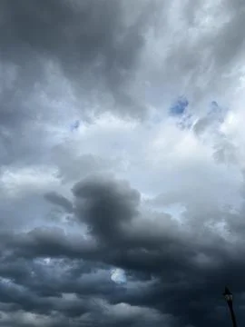 Dark Rain Clouds with Blue Sky Opening Stock Photos