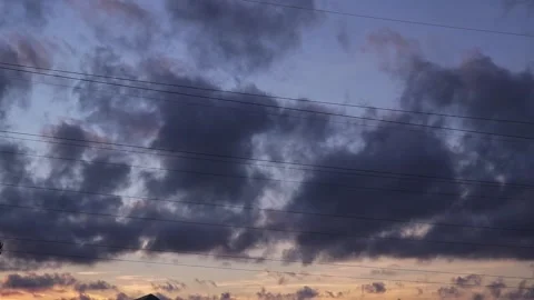 Dark rain clouds covering blue sky on evening sunset summer cloudscape timelapse Stock Footage 163185553