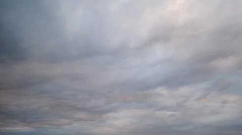 Dark rain clouds in the evening sky, timelapse. Dramatic sky with an coming c Stock Photos